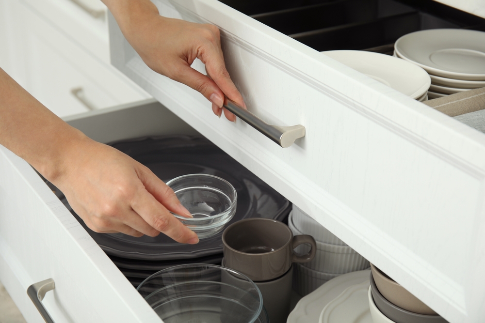 Clean dishes in a cupboard.